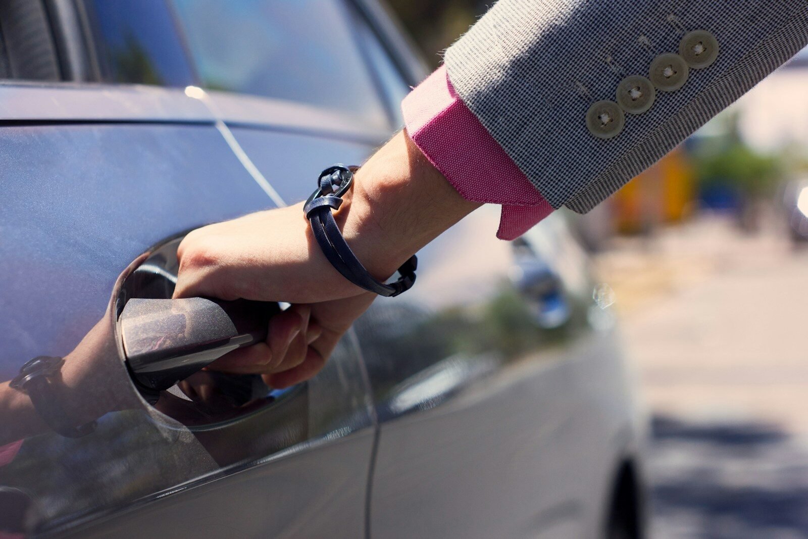 a person holding a steering wheel