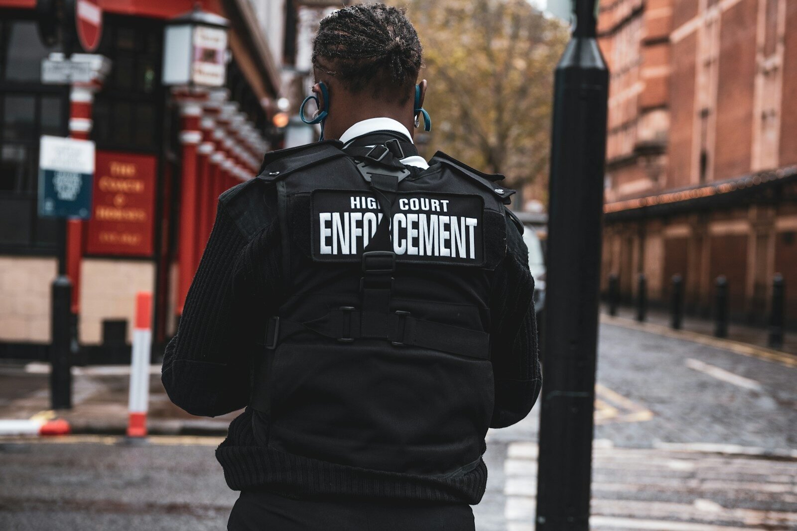 man in black and white adidas jacket wearing black and white headphones