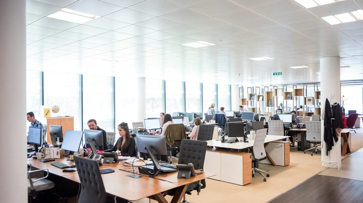 people working at desks in open office