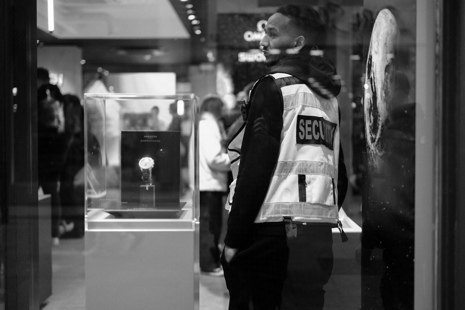 Security guard wearing a reflective vest in a store